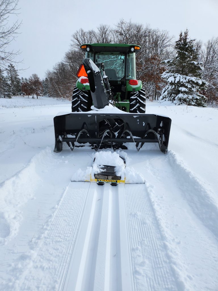 20221217_113314 (002) tractor laying classic XC ski trail.